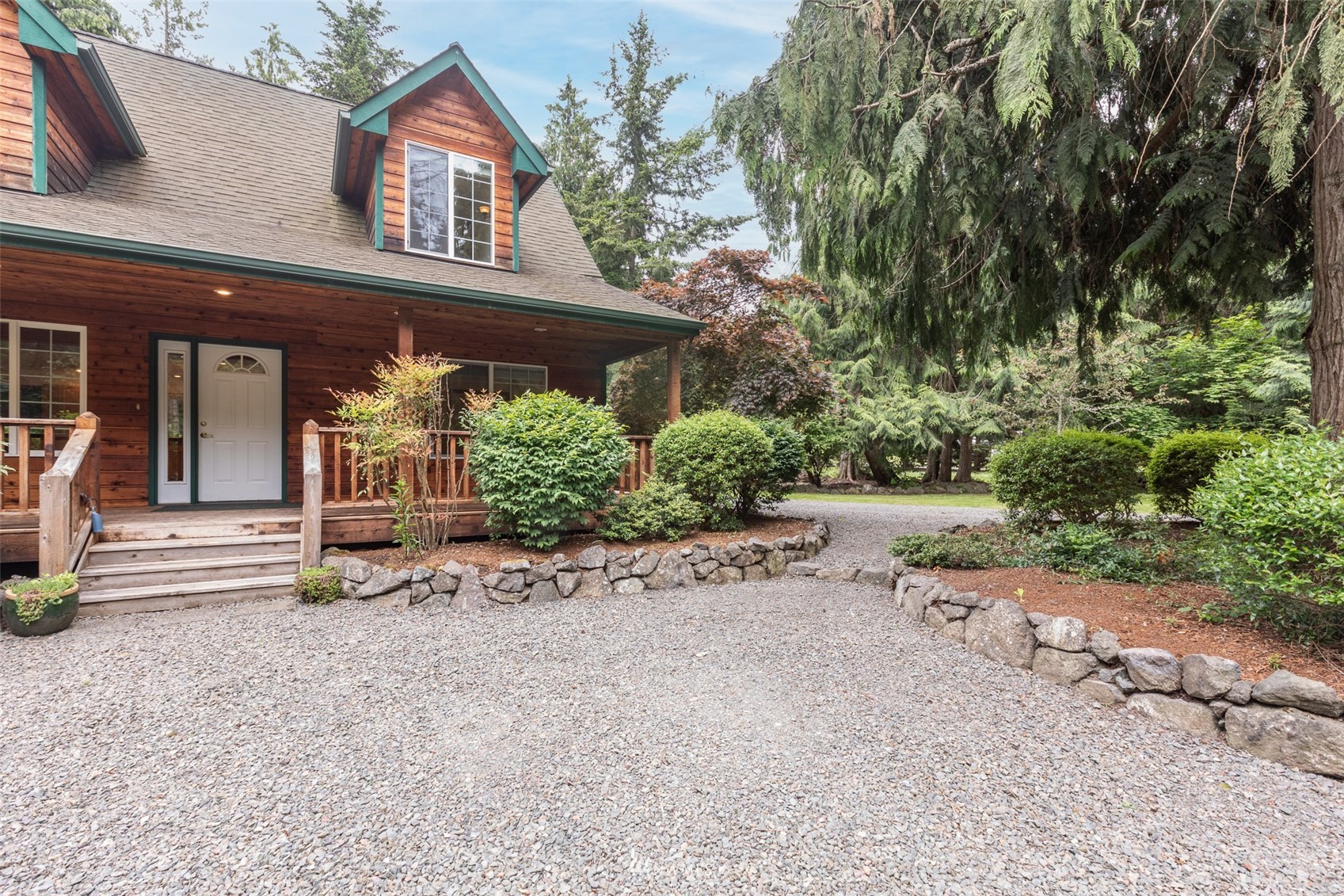 257 Riverside Road Sequim, WA 98382 - Photo 2 of 40 front view of a house with a yard