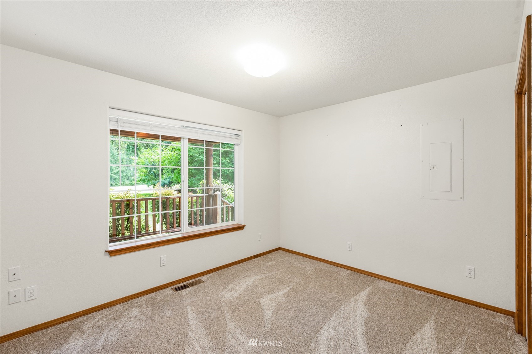 257 Riverside Road Sequim, WA 98382 - Photo 21 of 40 a view of an empty room with a window