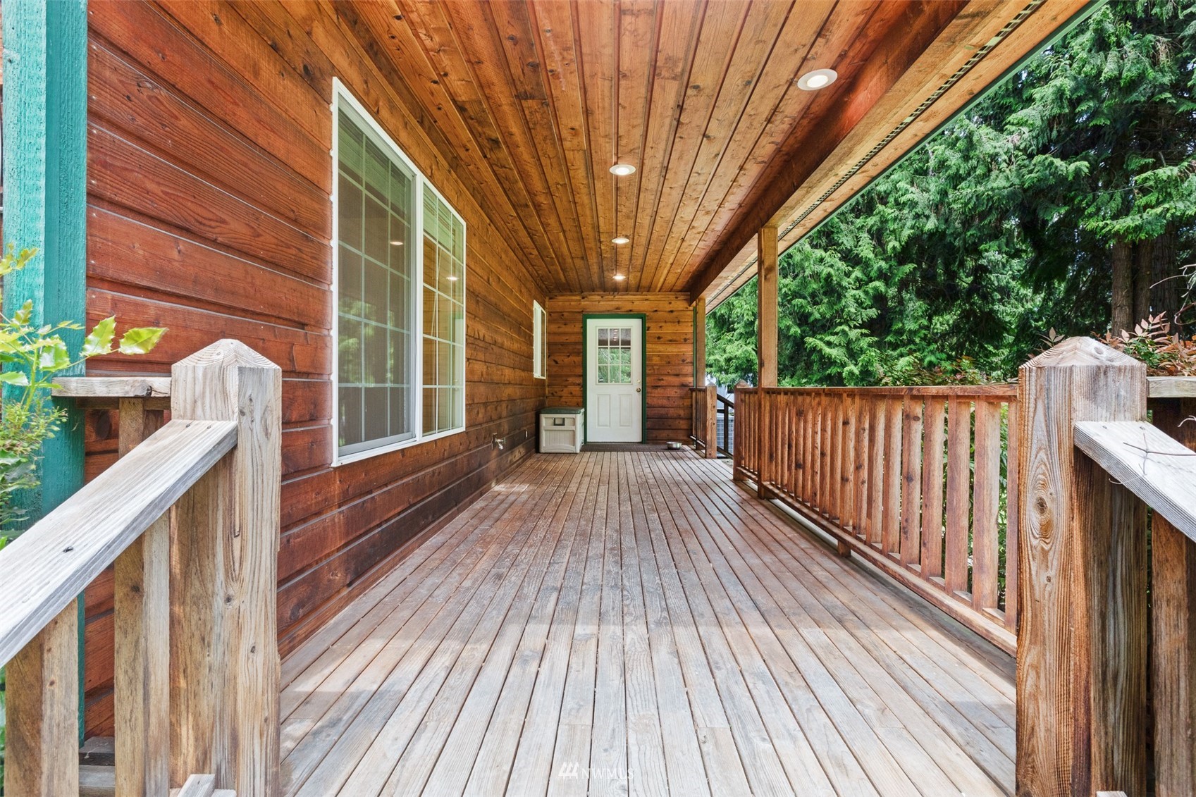 257 Riverside Road Sequim, WA 98382 - Photo 30 of 40 a view of backyard with a deck and wooden floor