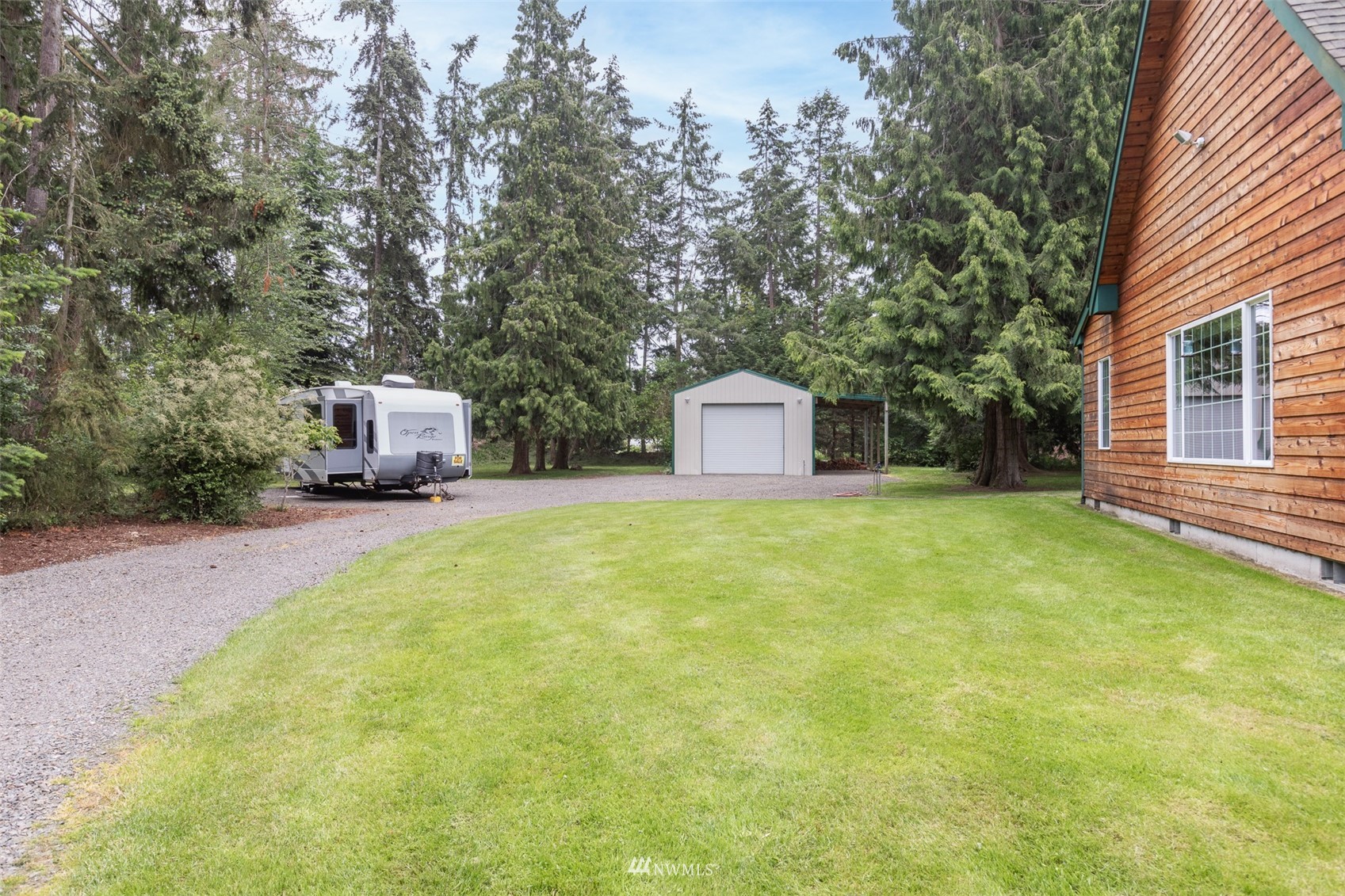 257 Riverside Road Sequim, WA 98382 - Photo 34 of 40 a house view with a trees
