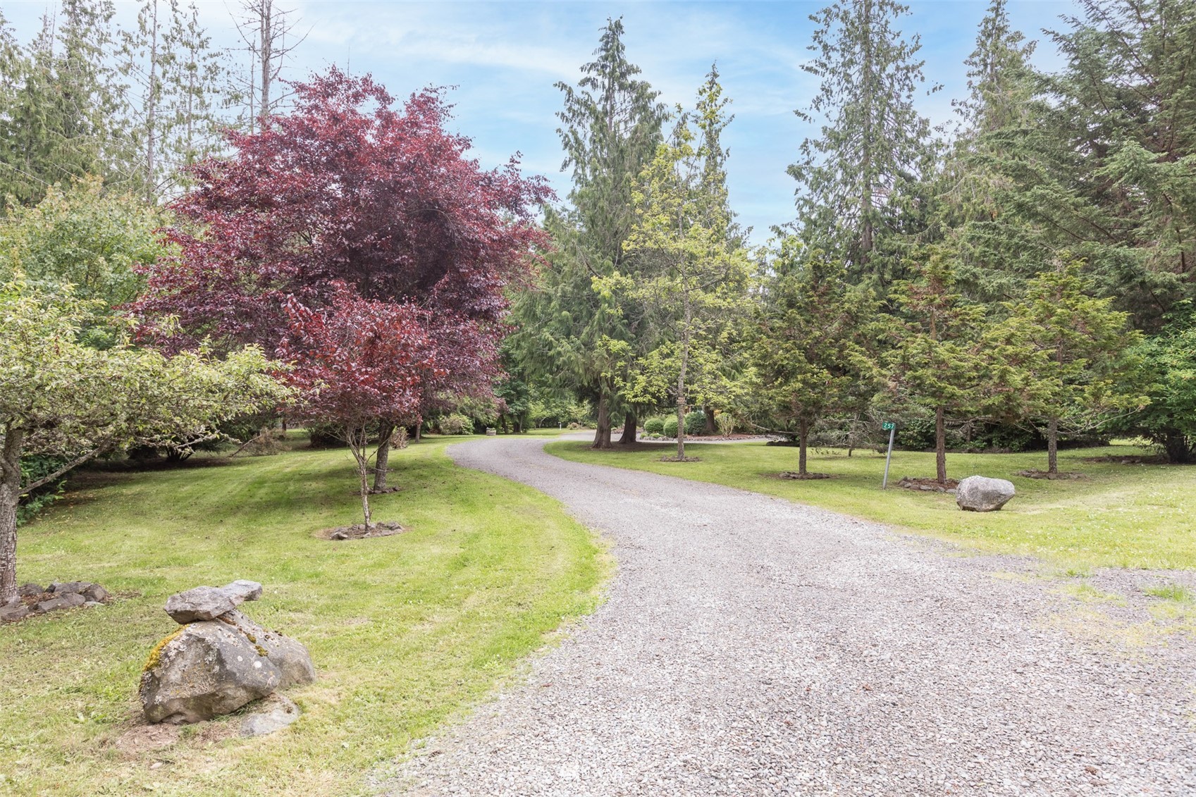 257 Riverside Road Sequim, WA 98382 - Photo 35 of 40 a swimming pool with lots of tress in front of it
