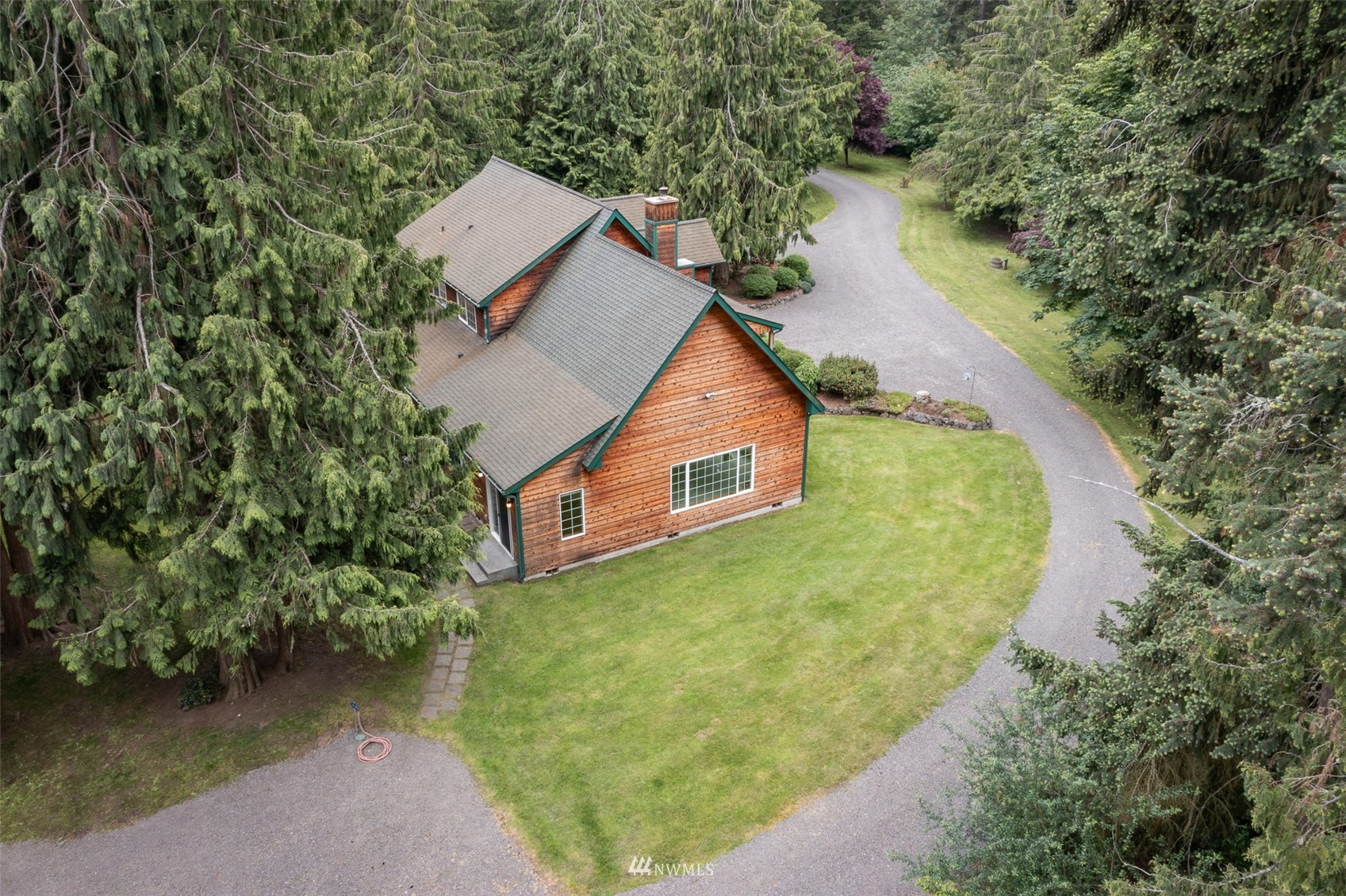 257 Riverside Road Sequim, WA 98382 - Photo 40 of 40 an aerial view of a house with a yard and lake view