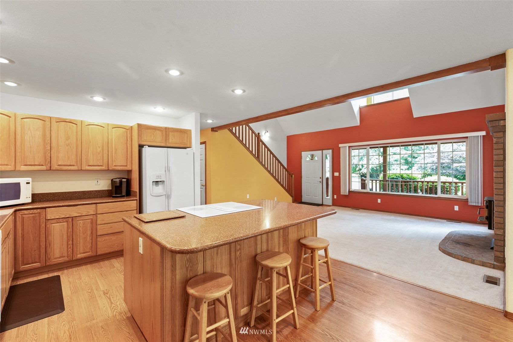 257 Riverside Road Sequim, WA 98382 - Photo 8 of 40 a kitchen with stainless steel appliances granite countertop a refrigerator a sink dishwasher and a stove with wooden floor