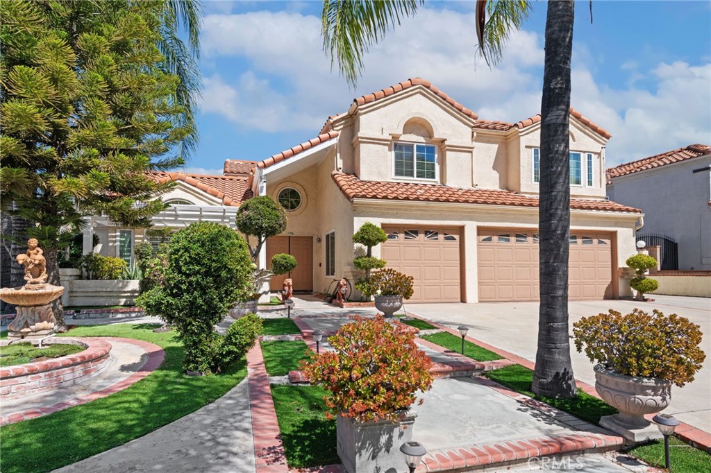 3047 Prado Lane Colton, CA 92324 - Photo 1 of 51 a front view of a house with a garden