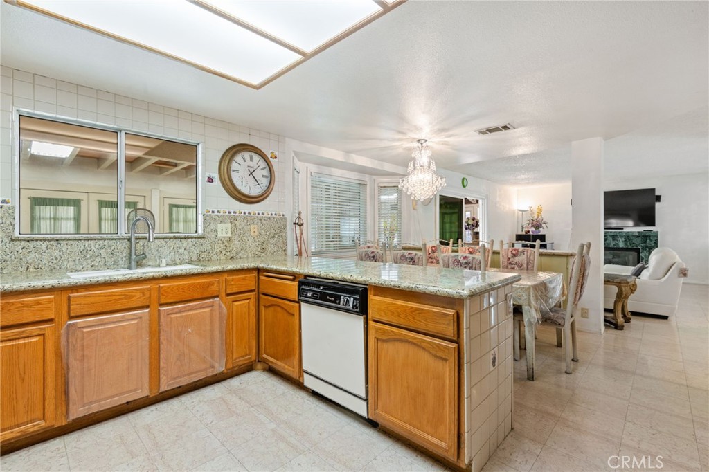 3047 Prado Lane Colton, CA 92324 - Photo 12 of 51 a kitchen with stainless steel appliances granite countertop a stove and a sink