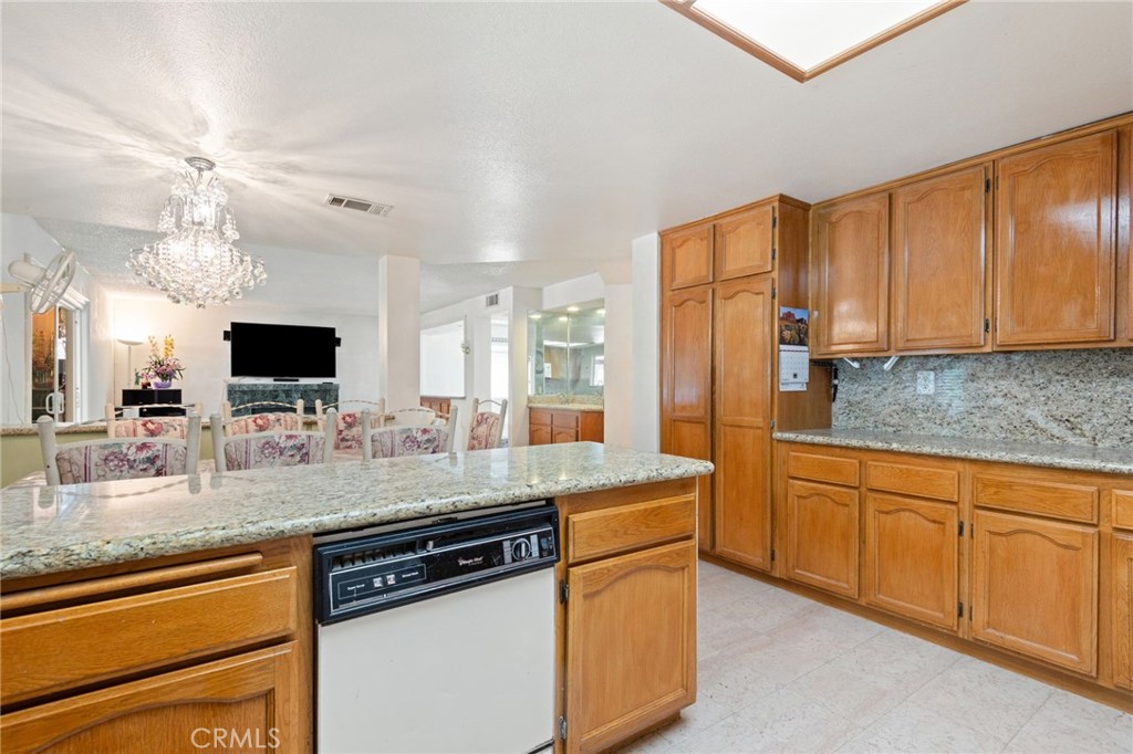 3047 Prado Lane Colton, CA 92324 - Photo 13 of 51 a kitchen with stainless steel appliances granite countertop a sink stove and refrigerator