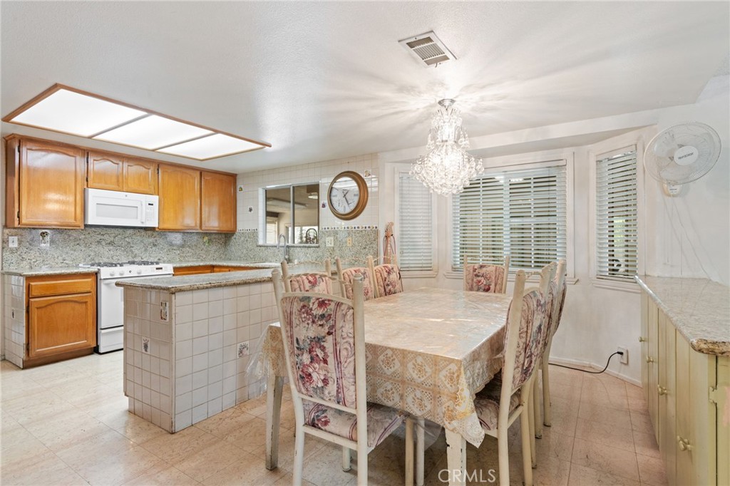 3047 Prado Lane Colton, CA 92324 - Photo 15 of 51 a view of a dining room with furniture and window