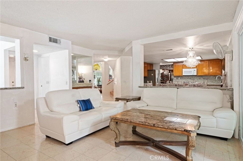3047 Prado Lane Colton, CA 92324 - Photo 19 of 51 a living room with furniture and a flat screen tv