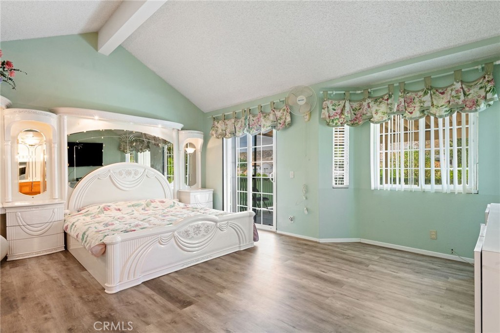 3047 Prado Lane Colton, CA 92324 - Photo 20 of 51 a bedroom with a large bed and a large window