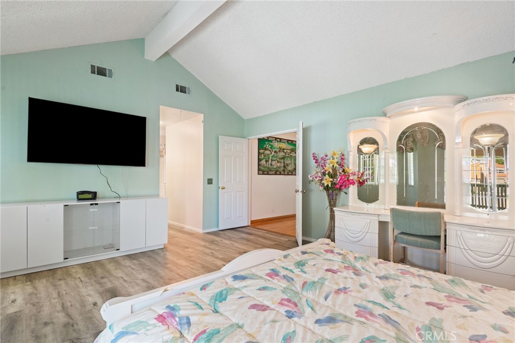 3047 Prado Lane Colton, CA 92324 - Photo 22 of 51 a bedroom with a bed and flat screen tv
