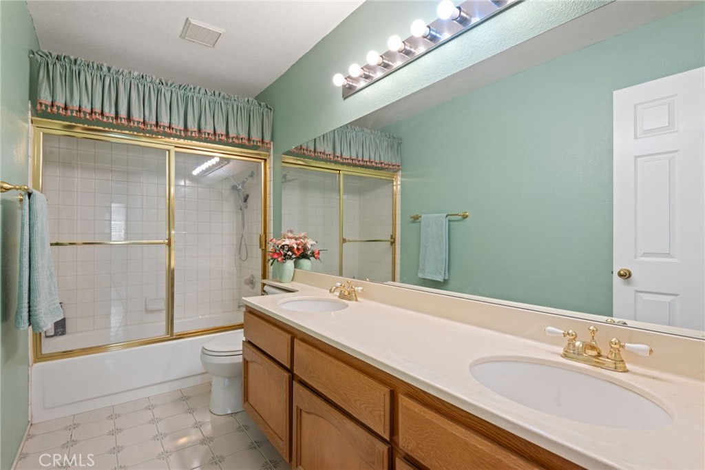 3047 Prado Lane Colton, CA 92324 - Photo 30 of 51 a bathroom with a sink double vanity and a mirror
