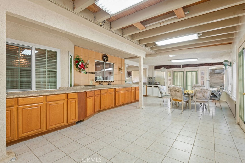3047 Prado Lane Colton, CA 92324 - Photo 35 of 51 a view of a kitchen with dining area windows and chairs