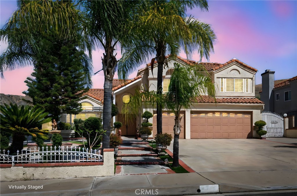 3047 Prado Lane Colton, CA 92324 - Photo 4 of 51 a front view of a house with a garden