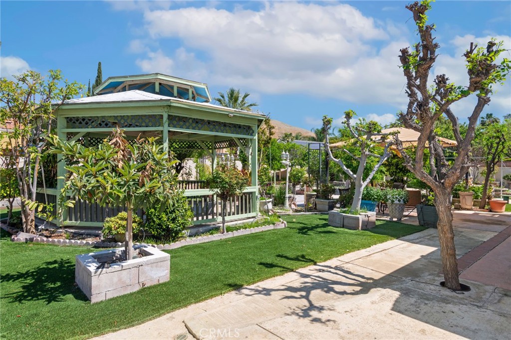 3047 Prado Lane Colton, CA 92324 - Photo 43 of 51 a front view of a house with a garden