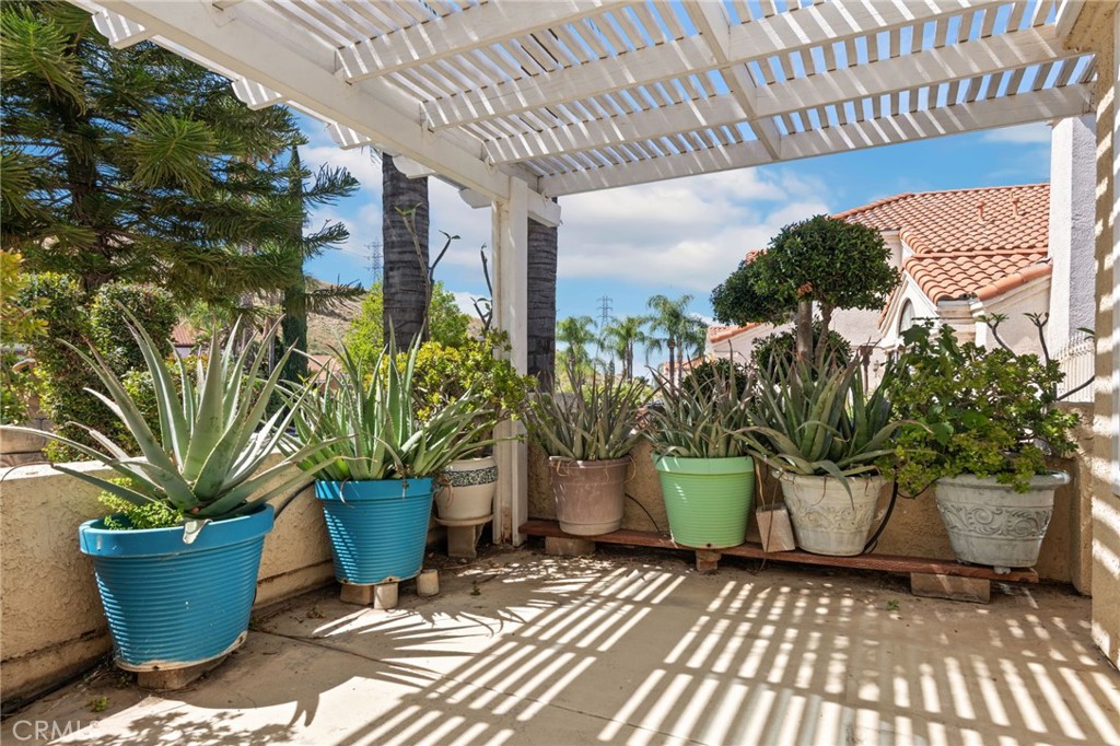 3047 Prado Lane Colton, CA 92324 - Photo 49 of 51 a view of a garden with chair and potted plants