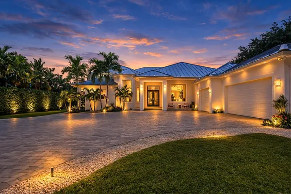 a view of water with a big yard