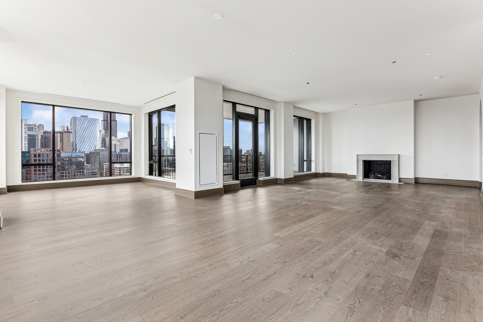 21 North May Street, Unit 1402 Chicago, IL 60607 - Photo 13 of 49 a view of an empty room with glass door and a window