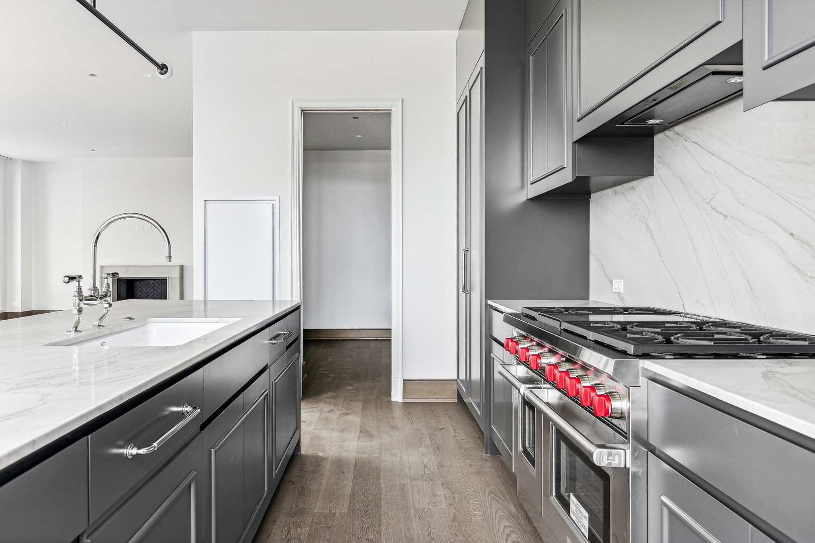 21 North May Street, Unit 1402 Chicago, IL 60607 - Photo 23 of 49 a kitchen with stainless steel appliances a sink stove and cabinets