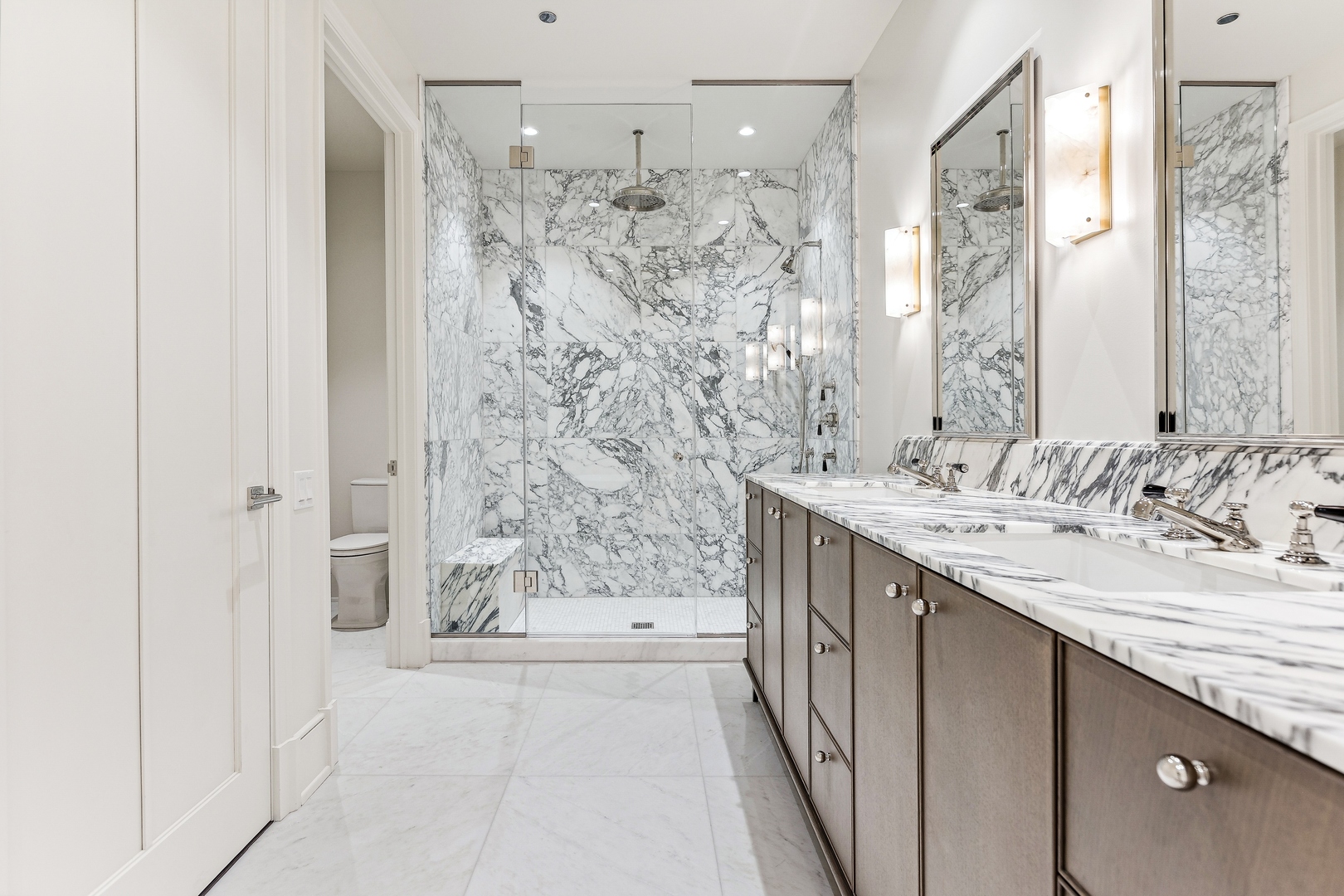 21 North May Street, Unit 1402 Chicago, IL 60607 - Photo 30 of 49 a bathroom with a granite countertop sink a mirror a shower and a bathtub