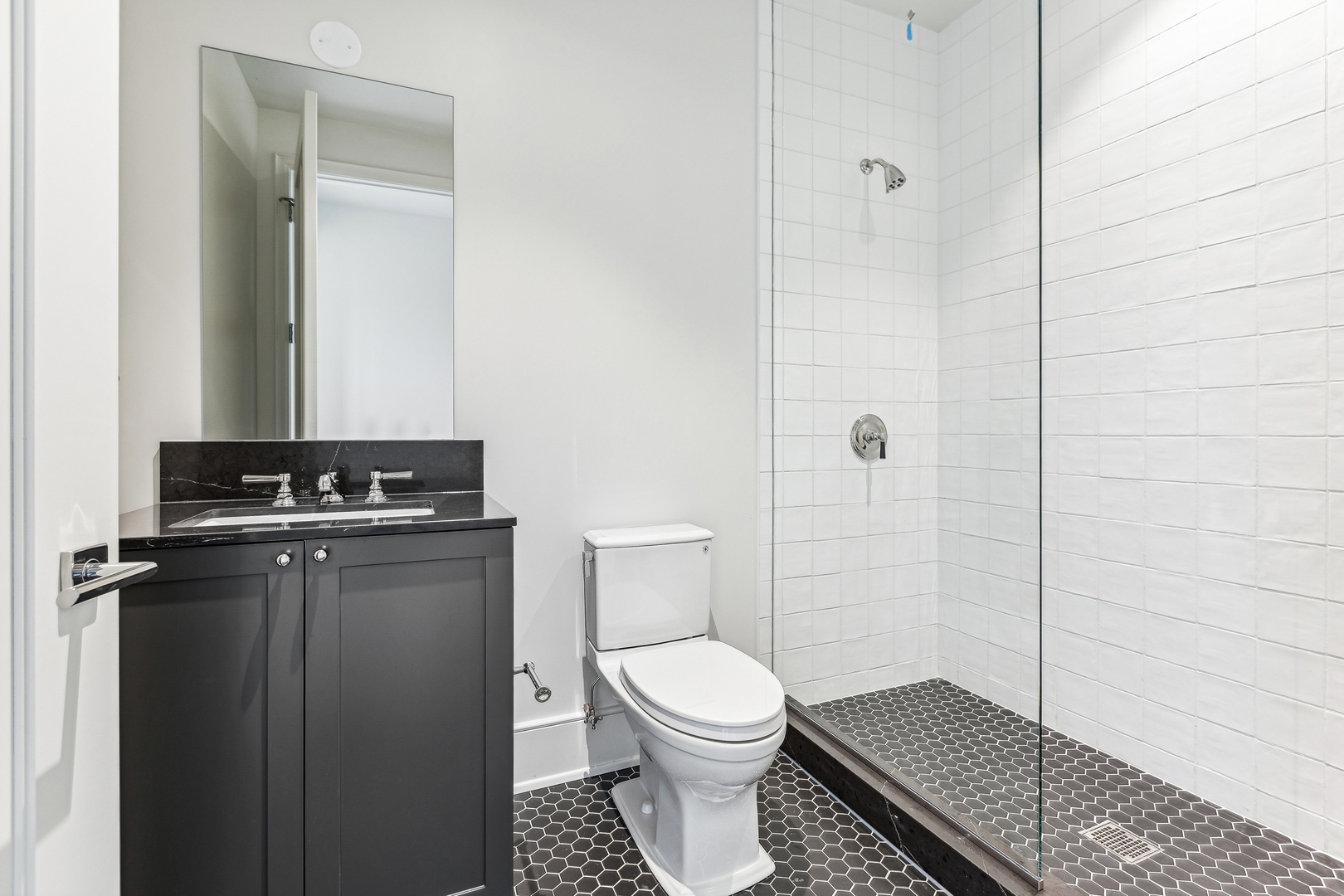 21 North May Street, Unit 1402 Chicago, IL 60607 - Photo 42 of 49 a bathroom with a toilet and a shower