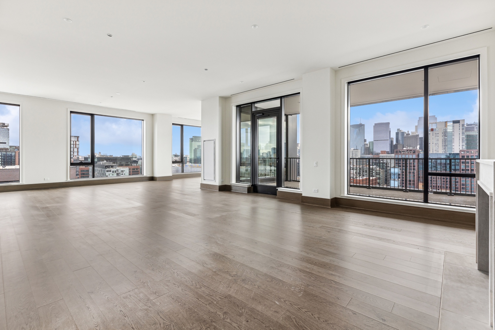 21 North May Street, Unit 1402 Chicago, IL 60607 - Photo 7 of 49 a view of an empty room with window and wooden floor