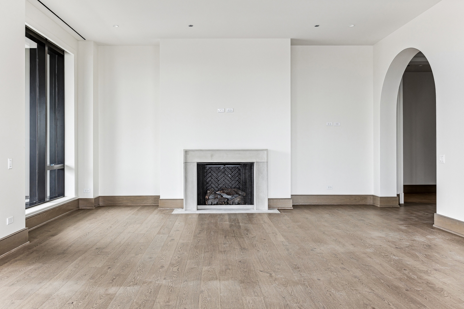 21 North May Street, Unit 1402 Chicago, IL 60607 - Photo 10 of 49 a view of an empty room with a fireplace and a window