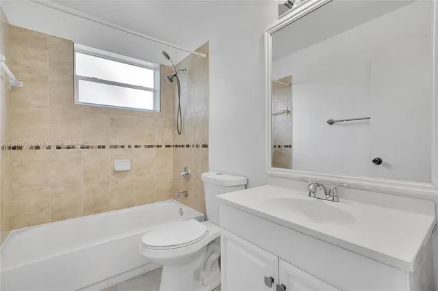 a bathroom with a sink a toilet and a bathtub