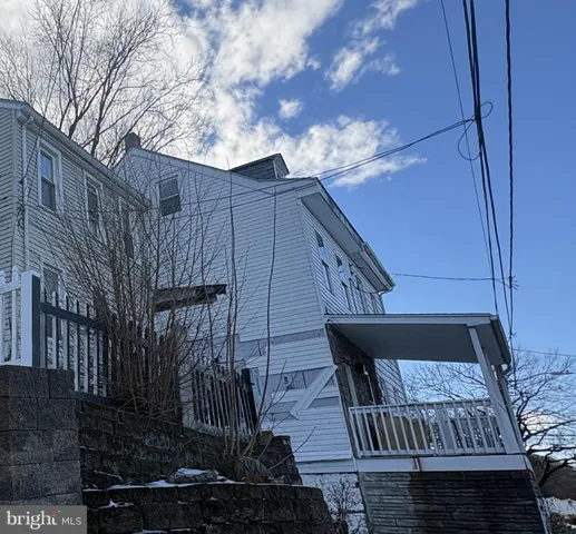 a view of balcony with wooden wall