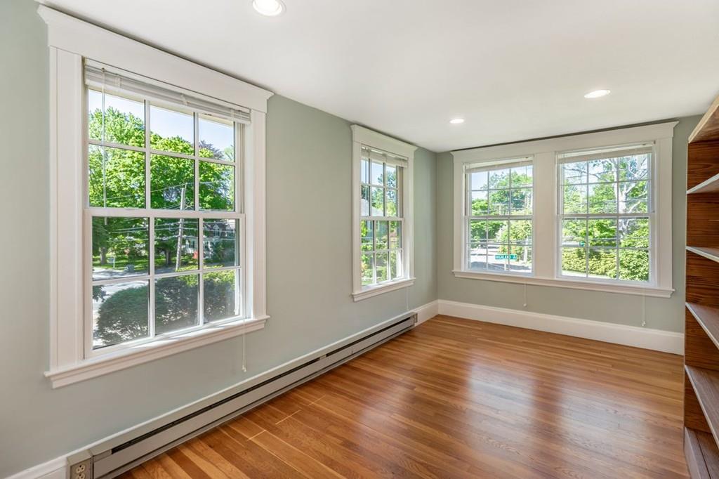 2 Highland Avenue Lexington, MA 02421 - Photo 23 of 32 a view of an empty room with wooden floor and a window