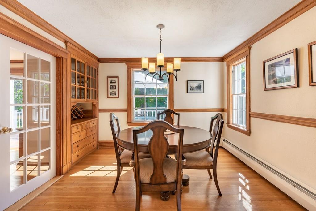 2 Highland Avenue Lexington, MA 02421 - Photo 8 of 32 a dining room with furniture a chandelier and wooden floor