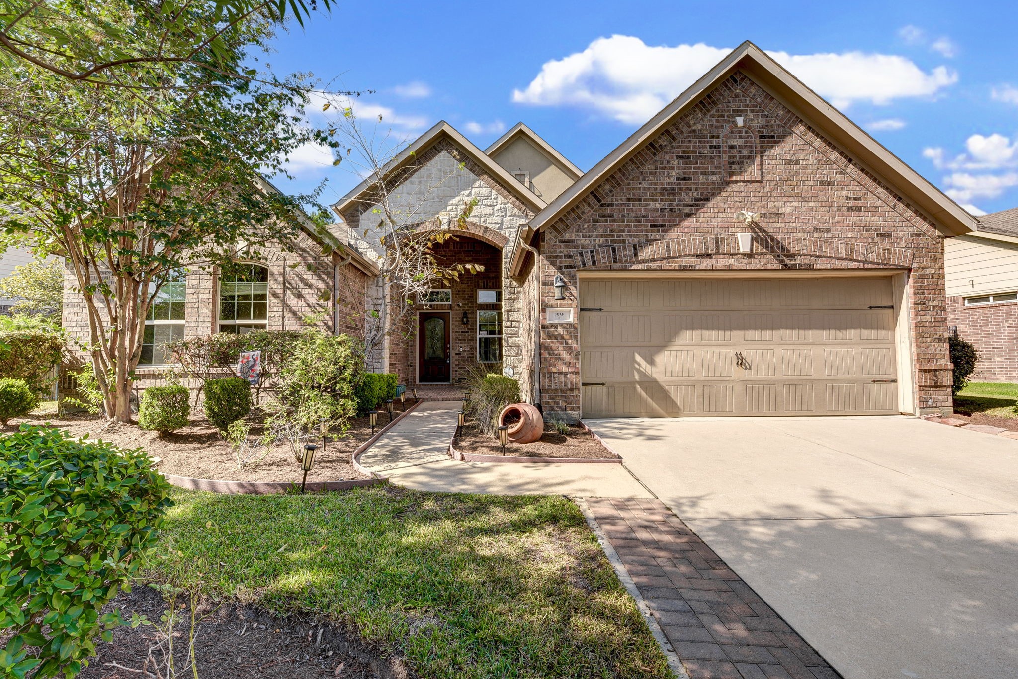 39 South Pinto Point Circle Spring, TX 77389 - Photo 1 of 48 a view of a house with yard and sitting area