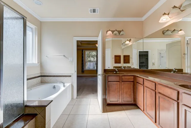 a bathroom with a tub and a shower