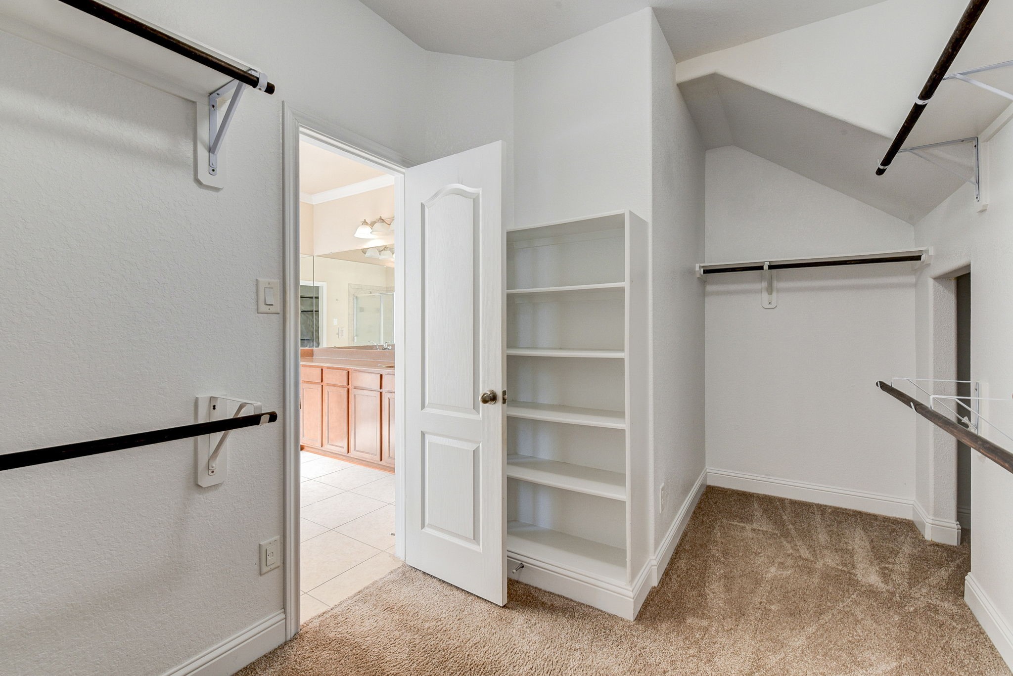 39 South Pinto Point Circle Spring, TX 77389 - Photo 28 of 48 a view of walk in closet with empty racks