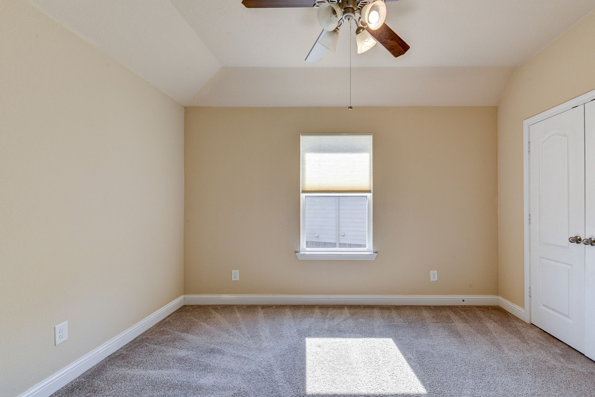 39 South Pinto Point Circle Spring, TX 77389 - Photo 40 of 48 an empty room with a window and a ceiling fan