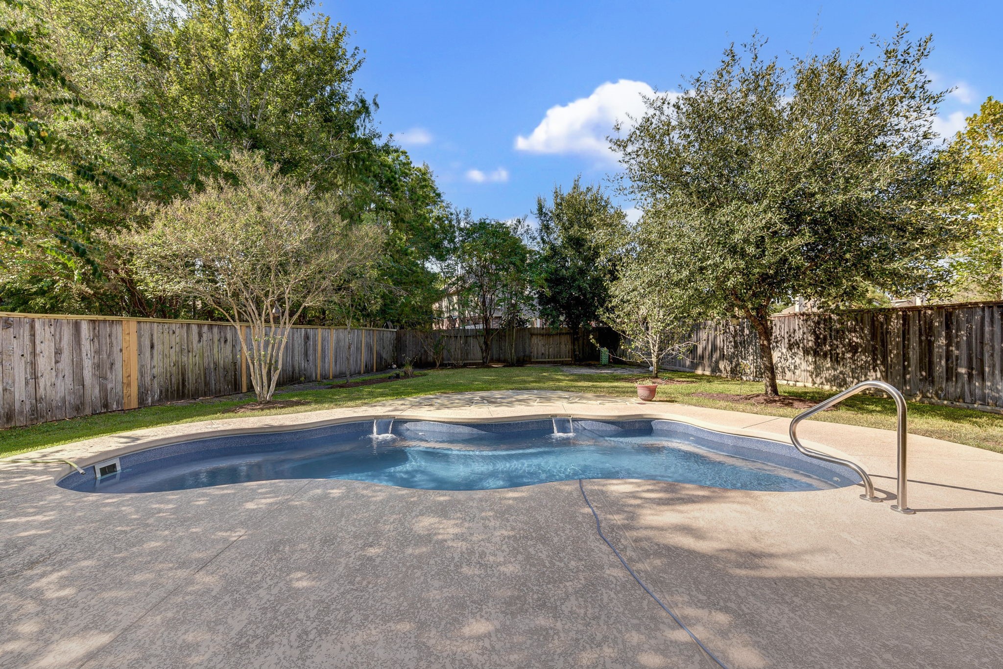 39 South Pinto Point Circle Spring, TX 77389 - Photo 44 of 48 a view of swimming pool with wooden fence