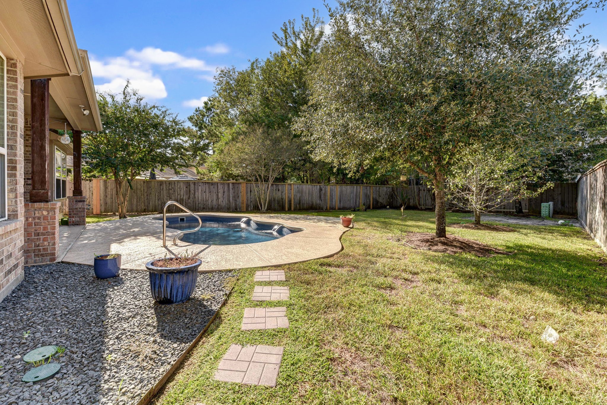 39 South Pinto Point Circle Spring, TX 77389 - Photo 45 of 48 a view of a yard with swimming pool