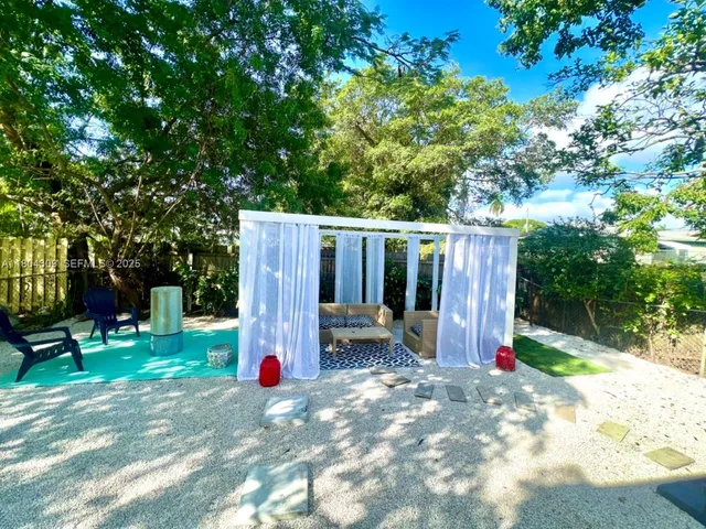 a view of a park with large tree