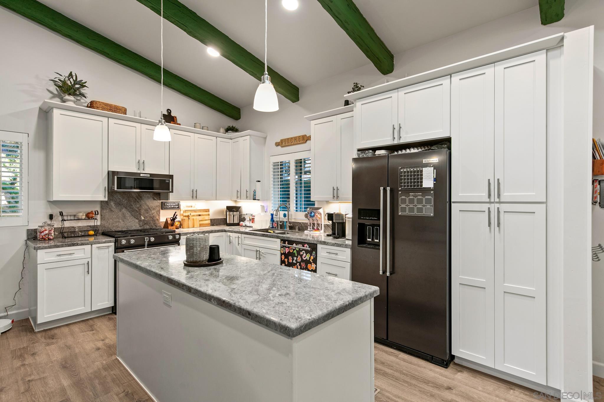 580 South Grade Road Alpine, CA 91901 - Photo 45 of 53 a kitchen with granite countertop a refrigerator stove and sink
