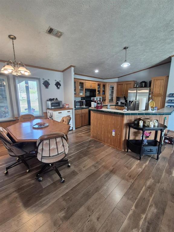 438 Silver River Road Gholson, TX 76705 - Photo 12 of 39 a living room with furniture and kitchen view