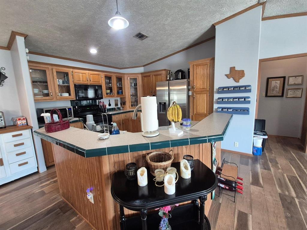 438 Silver River Road Gholson, TX 76705 - Photo 15 of 39 a dinning table and chairs in a room
