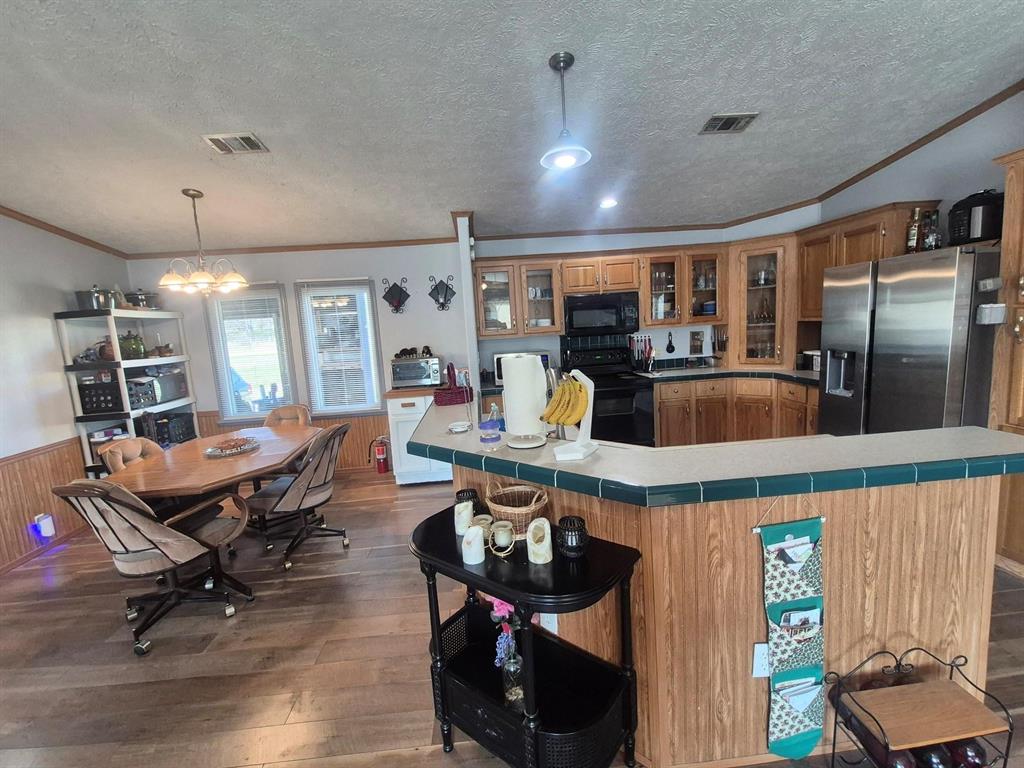 438 Silver River Road Gholson, TX 76705 - Photo 22 of 39 a living room with furniture a counter space and furniture