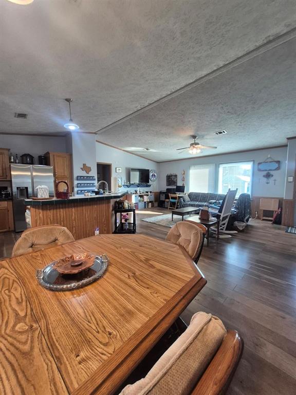 438 Silver River Road Gholson, TX 76705 - Photo 7 of 39 a bed room with furniture and kitchen view