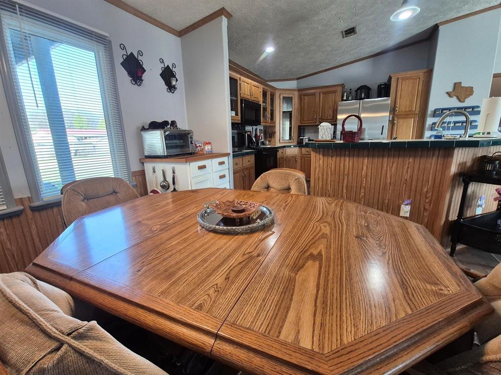 438 Silver River Road Gholson, TX 76705 - Photo 8 of 39 a bed room with furniture and window