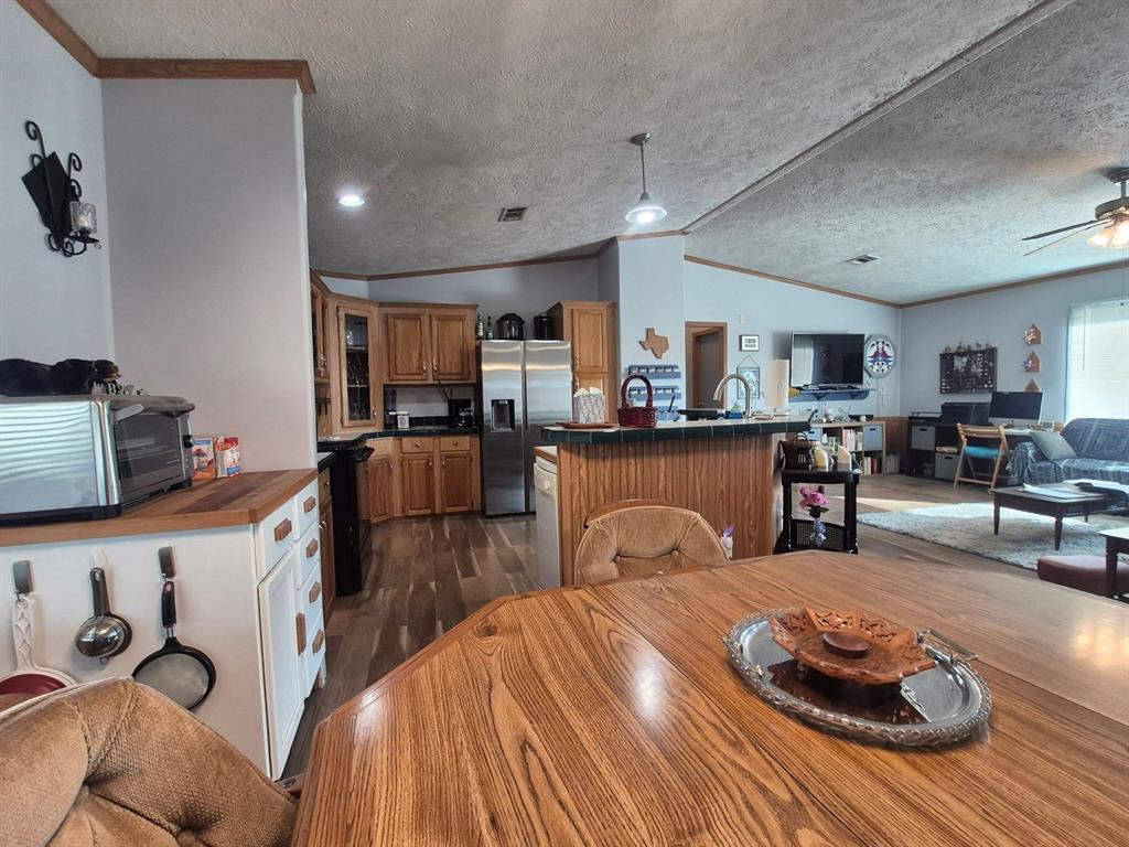 438 Silver River Road Gholson, TX 76705 - Photo 9 of 39 a living room with furniture and kitchen view