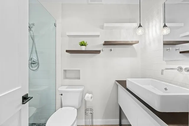 a bathroom with a sink and toilet