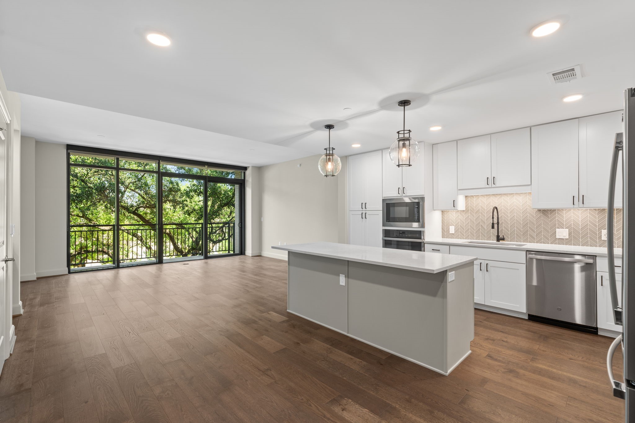 a kitchen with a sink window and cabinets