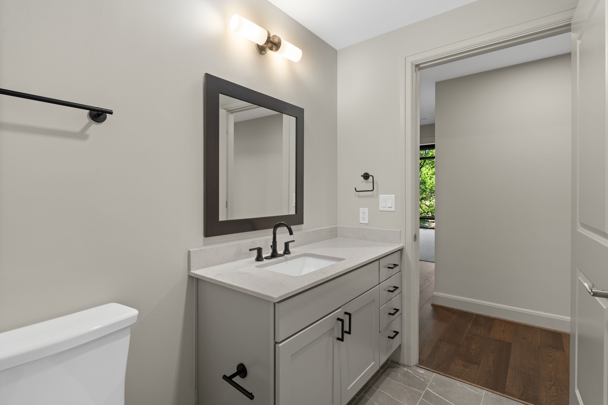 2511 Willowick Road, Unit 539 Houston, TX 77027 - Photo 14 of 45 a bathroom with a sink and a mirror