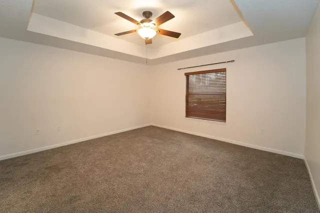 a view of a street with houses on the side