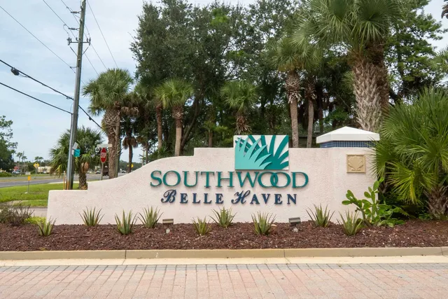 a view of a livingroom with a ceiling fan and window