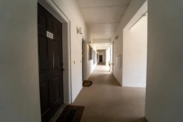 a view of a swimming pool with a lounge chair